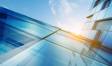 vertical view into sky along building